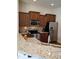 Kitchen boasts granite countertops, tiled backsplash and stainless appliances at 243 Nortwick Rd, Rolesville, NC 27571
