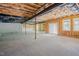 Unfinished basement shows concrete floors, insulation and natural light from windows at 2737 Willow Rock Ln, Apex, NC 27523