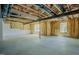 Unfinished basement featuring exposed insulation, windows, and concrete floor at 2737 Willow Rock Ln, Apex, NC 27523