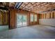 Unfinished basement with sliding glass doors to exterior, windows, and concrete flooring at 2737 Willow Rock Ln, Apex, NC 27523