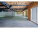 Spacious unfinished basement with concrete flooring and abundant natural light at 2737 Willow Rock Ln, Apex, NC 27523