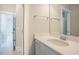 Well-lit bathroom featuring single sink vanity and large mirror at 2737 Willow Rock Ln, Apex, NC 27523