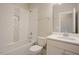 Well-lit bathroom featuring tiled shower and updated vanity with sink at 2737 Willow Rock Ln, Apex, NC 27523