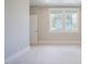Spacious bedroom featuring soft carpeting, fresh paint, and bright natural light at 2737 Willow Rock Ln, Apex, NC 27523