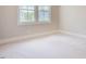 Inviting carpeted bedroom with fresh paint and bright natural light at 2737 Willow Rock Ln, Apex, NC 27523