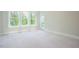 Bright bedroom showcasing large windows offering plenty of natural light at 2737 Willow Rock Ln, Apex, NC 27523