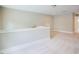 Spacious bonus room is brightened with neutral carpet, white trim and accents, and natural light at 2737 Willow Rock Ln, Apex, NC 27523