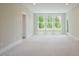 Spacious bonus room with large windows bringing in lots of natural light at 2737 Willow Rock Ln, Apex, NC 27523