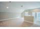 Bonus Room featuring soft carpet, fresh paint, and natural light at 2737 Willow Rock Ln, Apex, NC 27523