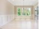 Dining room with natural light, chandelier, and a sliding door to porch for outdoor dining at 2737 Willow Rock Ln, Apex, NC 27523