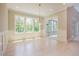 Dining room with large windows and light wood floors, ideal for Gathering meals and entertaining guests at 2737 Willow Rock Ln, Apex, NC 27523