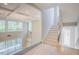 Foyer showcasing staircase and a glass-enclosed overlook area at 2737 Willow Rock Ln, Apex, NC 27523