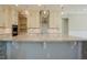 Bright kitchen features granite counters, stainless appliances, tile backsplash, and pendant lighting at 2737 Willow Rock Ln, Apex, NC 27523