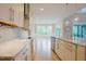 Bright kitchen features granite counters, stainless appliances, tile backsplash, and pendant lighting at 2737 Willow Rock Ln, Apex, NC 27523