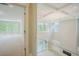 Bright living room boasts soaring ceilings, chandelier lighting, and glass-enclosed balcony at 2737 Willow Rock Ln, Apex, NC 27523