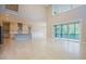 Open concept living room and kitchen with sliding door to outdoor space and vaulted ceiling at 2737 Willow Rock Ln, Apex, NC 27523