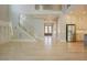 Open floor plan showcasing staircase, kitchen, and living room with hardwood flooring at 2737 Willow Rock Ln, Apex, NC 27523