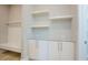 Mudroom with coat hooks, bench, and built-in cabinets, offering practical storage solutions at 2737 Willow Rock Ln, Apex, NC 27523