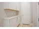 White mudroom with upper and lower cabinets offering ample storage space at 2737 Willow Rock Ln, Apex, NC 27523