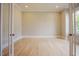 Well-lit office featuring hardwood floors and glass paneled doors for privacy at 2737 Willow Rock Ln, Apex, NC 27523