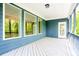 Covered porch with painted wood deck and railings at 2737 Willow Rock Ln, Apex, NC 27523