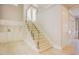Modern staircase with glass railing, built-in storage, and lots of natural light at 2737 Willow Rock Ln, Apex, NC 27523