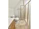 Cozy bathroom featuring a framed glass shower stall, a toilet, and a wooden cabinet at 2819 Ellis Chapel Rd, Bahama, NC 27503