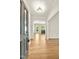 Inviting foyer with hardwood floors, arched doorway, and ample natural light flowing into the adjacent living spaces at 2819 Ellis Chapel Rd, Bahama, NC 27503