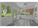 Inviting sunroom featuring hardwood floors, natural light from many windows, and a ceiling fan at 2819 Ellis Chapel Rd, Bahama, NC 27503
