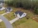 Aerial view of a well-maintained home with a spacious yard and appealing landscaping at 297 Sexton Ln, Wendell, NC 27591