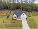 Aerial view of the home showcasing the well-manicured lawn and landscaping at 297 Sexton Ln, Wendell, NC 27591