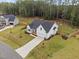 Aerial view of the home showing the driveway and landscaping at 297 Sexton Ln, Wendell, NC 27591