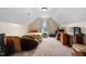 Spacious attic area with a bed, a beanbag and a window for natural light and ventilation at 297 Sexton Ln, Wendell, NC 27591