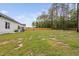 Large backyard with lawn, patio area, and privacy fence at 297 Sexton Ln, Wendell, NC 27591