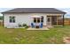 Backyard patio area with seating and a fire pit at 297 Sexton Ln, Wendell, NC 27591