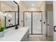Bright bathroom with a large shower and vanity with a modern design and large mirror at 297 Sexton Ln, Wendell, NC 27591