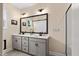 Bathroom featuring double sinks, a large mirror and a shower behind a sliding door at 297 Sexton Ln, Wendell, NC 27591