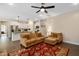 Open-concept living room flows into kitchen with granite countertops and island, creating an inviting space for entertaining at 297 Sexton Ln, Wendell, NC 27591