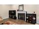 Inviting living room with a cozy fireplace and dark wood entertainment center and flooring at 297 Sexton Ln, Wendell, NC 27591