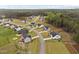 Residential neighborhood featuring new construction homes with well-manicured lawns and tree-lined streets at 297 Sexton Ln, Wendell, NC 27591