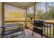 Covered patio with outdoor furniture and a grill perfect for entertaining guests at 297 Sexton Ln, Wendell, NC 27591
