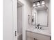 Bright bathroom with a stylish vanity, modern fixtures, and a decorative mirror, creating a relaxing ambiance at 300 Westerman Pl, Smithfield, NC 27577