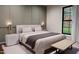Comfortable bedroom with a plush bed, stylish nightstands, and a window providing a serene outdoor view at 300 Westerman Pl, Smithfield, NC 27577