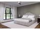 Comfortable bedroom with a large window, offering natural light and views of the surrounding outdoor scenery at 300 Westerman Pl, Smithfield, NC 27577