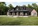 Beautiful two-story home with a covered front porch and well-manicured lawn at 300 Westerman Pl, Smithfield, NC 27577