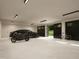 Spacious garage with a motorcycle, car, and bicycle offering ample storage and parking at 300 Westerman Pl, Smithfield, NC 27577