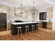 Modern kitchen featuring a large island, stainless steel appliances, and stylish pendant lighting at 300 Westerman Pl, Smithfield, NC 27577