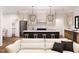 Open-concept living space featuring a modern kitchen and comfortable seating area at 300 Westerman Pl, Smithfield, NC 27577