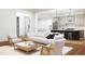 Spacious living room with neutral decor, hardwood floors, and an open layout to the kitchen at 300 Westerman Pl, Smithfield, NC 27577