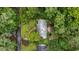 Aerial view of home featuring mature trees, a charming garden, and a brick walkway at 3125 Stanford Dr, Durham, NC 27707